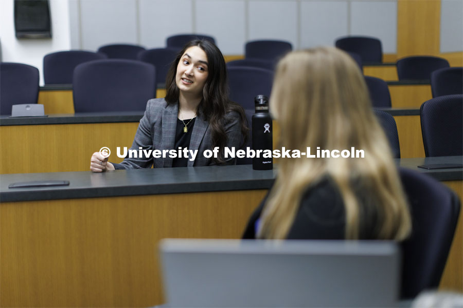 Students collaborating in a lecture hall in McCollum Hall. College of Law photo shoot. April 20, 2022. Photo by Craig Chandler / University Communication.