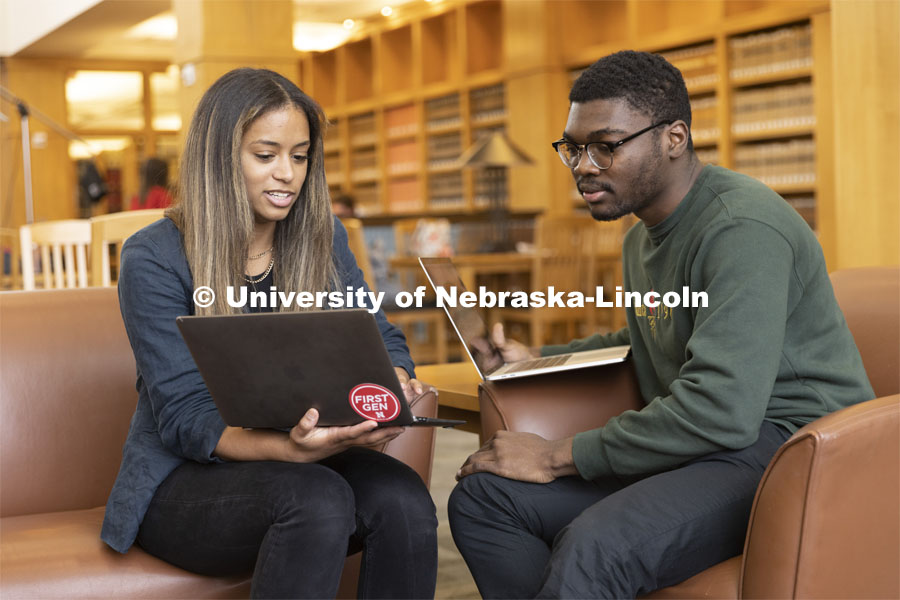 Two students compare laptop notes in the Schmid Law Library. College of Law photo shoot. April 20, 2022. Photo by Craig Chandler / University Communication.