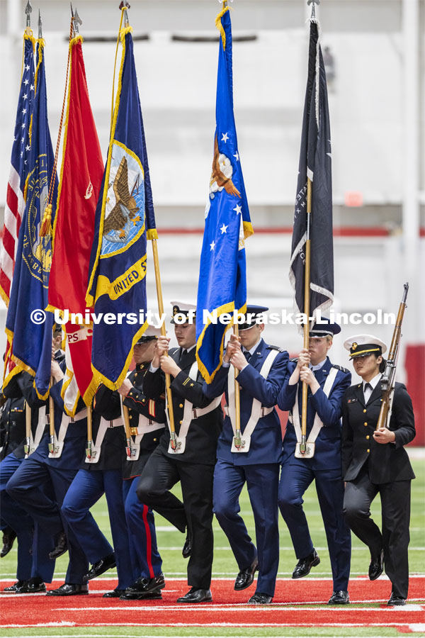 The Color Guard executes a wheeling movement as they present the colors. ROTC Joint Service Chancellor’s Review in Cook Pavilion. April 21, 2022. Photo by Craig Chandler / University Communication.