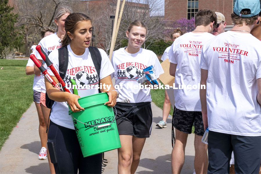 Alpha Xi Delta members collect their supplies at the start of The Big Event. The Big Event is organized annually by the Association of Students of the University of Nebraska (ASUN). Since 2006, more than 37,500 students at the University of Nebraska–Lincoln have completed 1,687,500 volunteer hours during The Big Event. April 23, 2022. Photo by Dillon Galloway / University Communication.