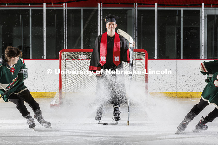 Alex Cathcart came to Nebraska to pursue a hockey career, but he scored with a mathematics degree from the University of Nebraska–Lincoln. He is assisted in the photo by John Rupert, a sophomore from Minnesota. May 2, 2022. Photo by Craig Chandler / University Communication.