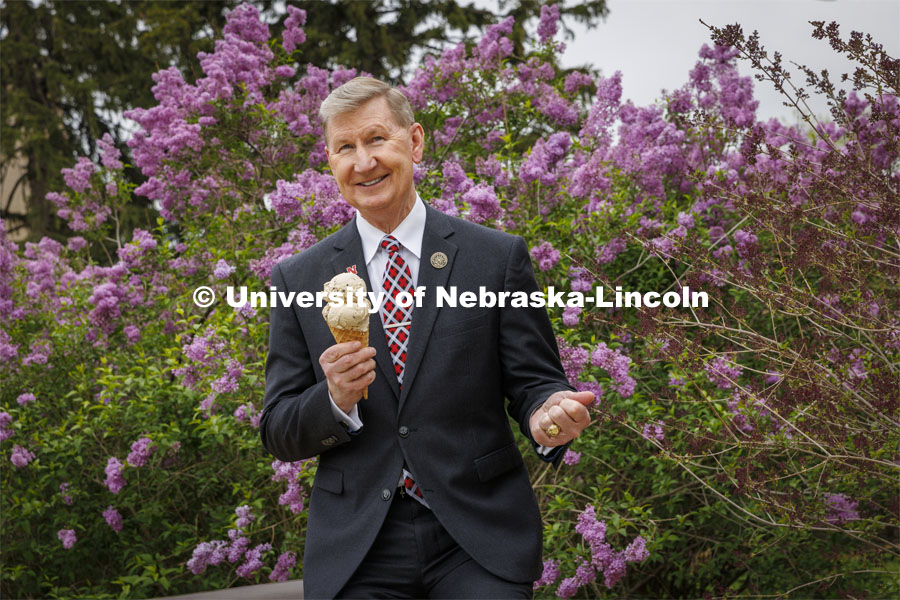 President Ted Carter of the University of Nebraska enjoys an ice cream cone of Carter’s Coffee Crunch, named for the new president. May 4, 2022.  Photo by Craig Chandler / University Communication. 