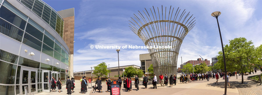 Grads line up outside Pinnacle Bank Arena before commencement. Graduate commencement in Pinnacle Bank Arena. May 13, 2022. Photo by Craig Chandler / University Communication.