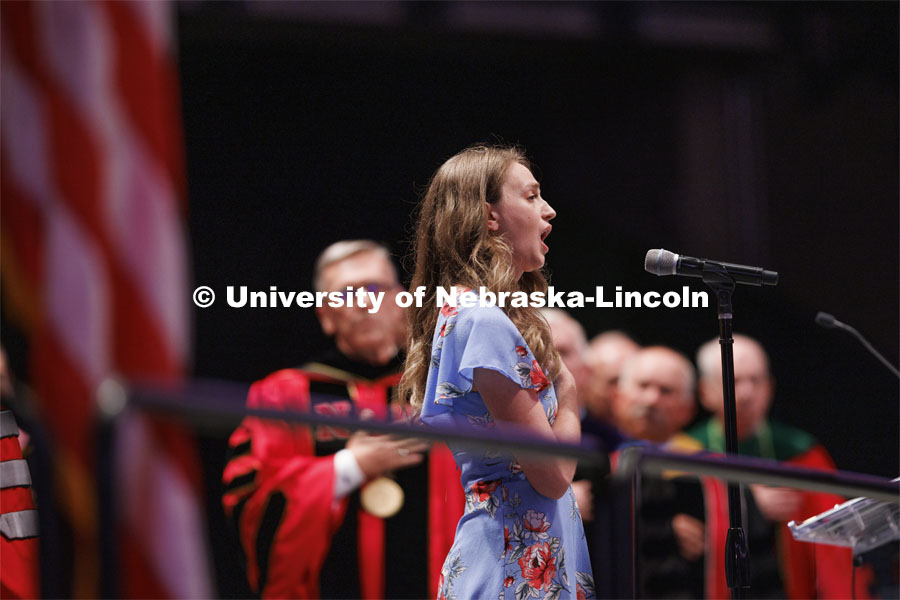 The national anthem is sung during Graduate commencement in Pinnacle Bank Arena. May 13, 2022. Photo by Craig Chandler / University Communication.