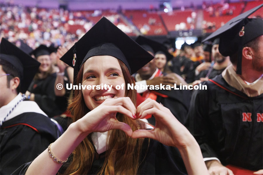 Crystal Zahler gives her love to her family in the arena. Graduate commencement in Pinnacle Bank Arena. May 13, 2022. Photo by Craig Chandler / University Communication.