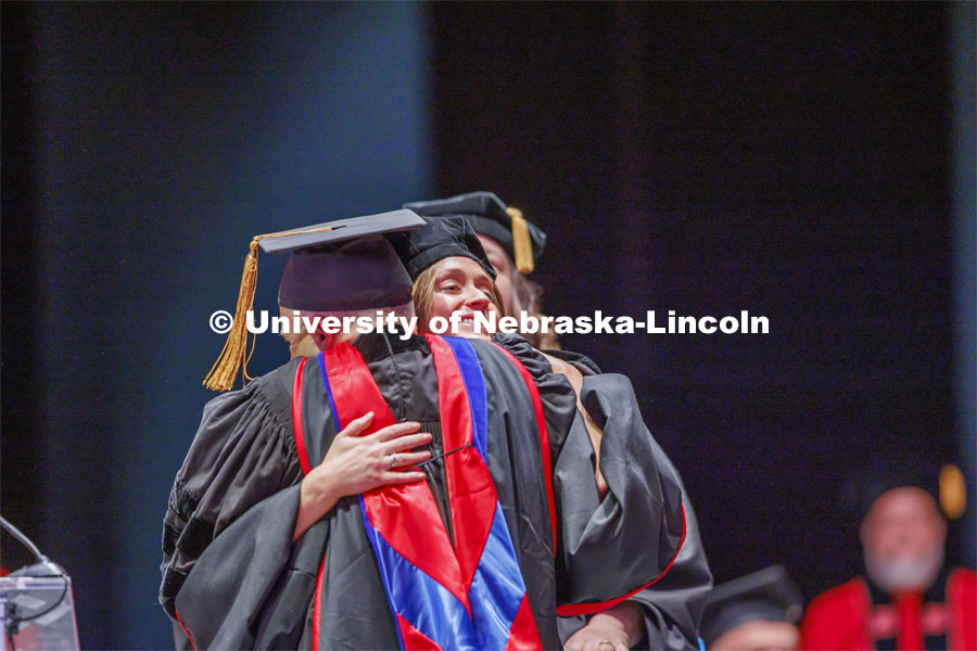 Hooding at graduate commencement in Pinnacle Bank Arena. May 13, 2022. Photo by Craig Chandler / University Communication.