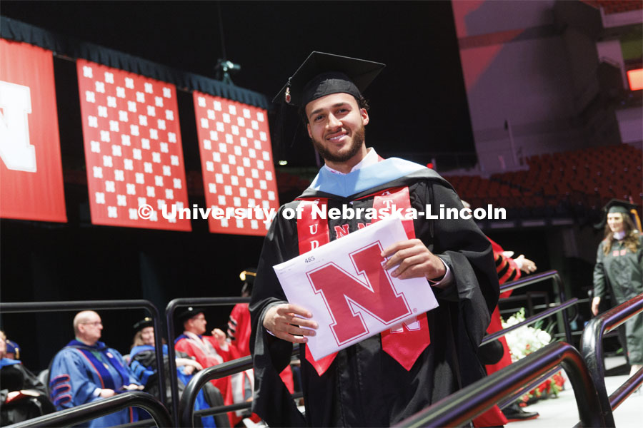 Kobe Webster receives his masters degree. The Huskers men’s basketball player received his masters degree Friday. The Husker athletes are wearing a custom stole during the commencements. Graduate commencement in Pinnacle Bank Arena. May 13, 2022. Photo by Craig Chandler / University Communication.