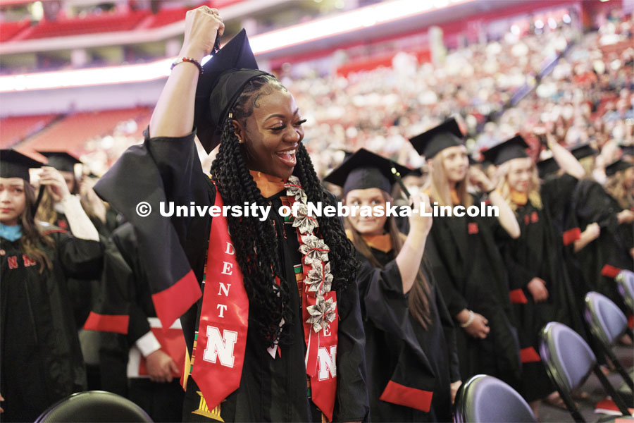 Mi’Cole Cayton moves her tassel during commencement. The Huskers women’s basketball player received her masters degree. The Husker athletes are wearing a custom stole during the commencements. Graduate commencement in Pinnacle Bank Arena. May 13, 2022. Photo by Craig Chandler / University Communication.