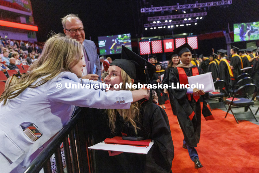 Ane Katerine Chacon De Anzola hugs her family members after receiving her masters degree. Graduate commencement in Pinnacle Bank Arena. May 13, 2022. Photo by Craig Chandler / University Communication.