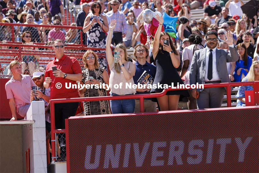 Friends and family crowd the rail to photograph their graduates. UNL undergraduate commencement in Memorial Stadium. May 14, 2022. Photo by Craig Chandler / University Communication.