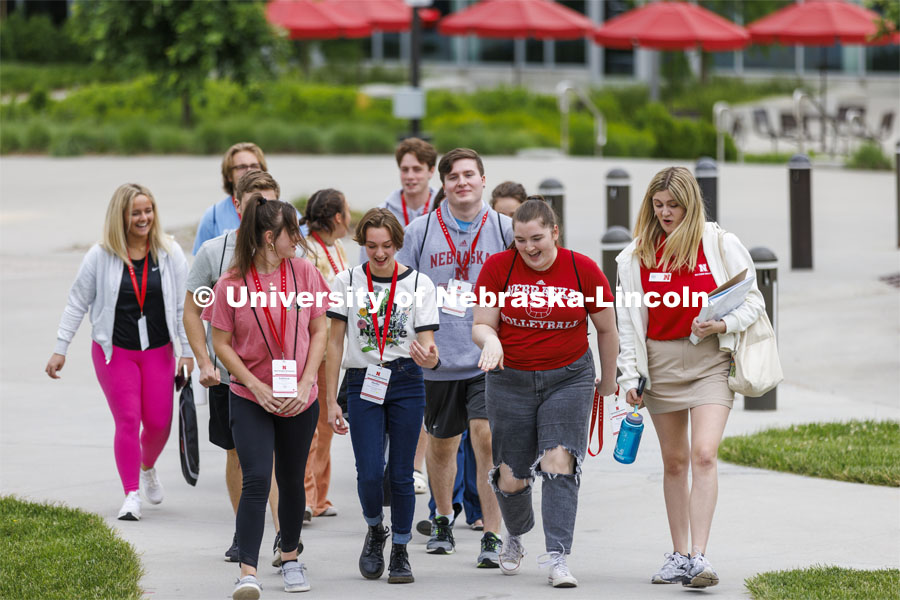 A group of NSE students led by Kate Vermilyea walk across campus. New Student Enrollment, June 1, 2022. Photo by Craig Chandler / University Communication.