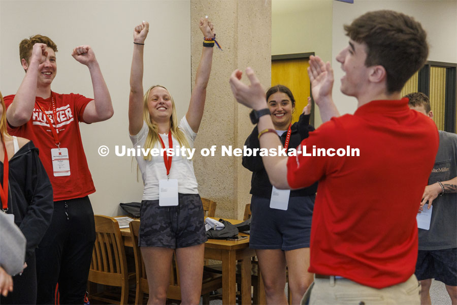 Jack Kinney’s group cheer after solving an ice breaker. New Student Enrollment. June 1, 2022. Photo by Craig Chandler / University Communication.