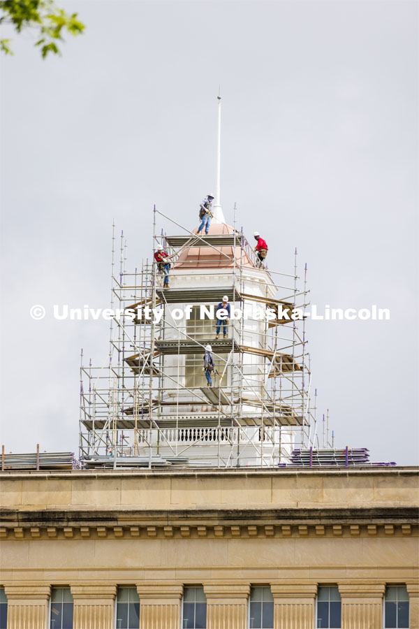 Scaffolding begins to surround the Love Library cupola as part of the renovation process. June 6, 2022. Photo by Craig Chandler / University Communication.