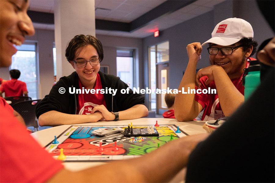 Attendees smile as they play a game of Sorry! at the Nebraska College Preparatory Academy’s Science Camp inside Abel Hall. NCPA, a program for academically talented, first-generation, income eligible students to help prepare them for college and their future careers. June 9, 2022. Photo by Jordan Opp for University Communication.