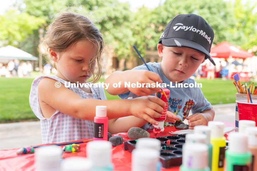 Two Discovery Day attendees pick different paint colors to paint rocks. The East Campus Discovery Days and Farmer’s Market at UNL is a fun, family-friendly event for all ages. It’s more than a farmer’s market. It’s more than a science day. Come for the hands-on, science-focused fun. Stay to enjoy live music and food trucks. Shop at our farmer’s market and vendor fair. June 11, 2022. Photo by Jordan Opp / University Communication.