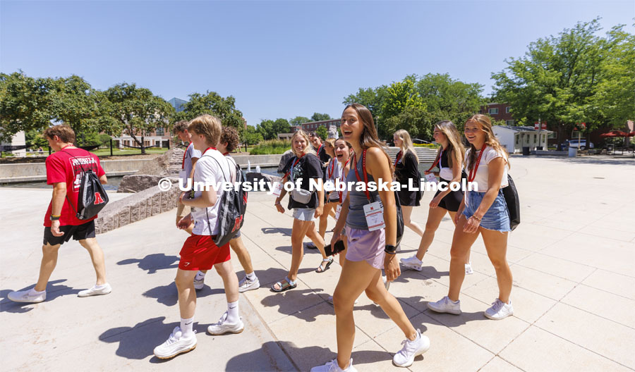 New Student Orientation Leader walking on campus with their student groups. June 16, 2022. Photo by Craig Chandler / University Communication.