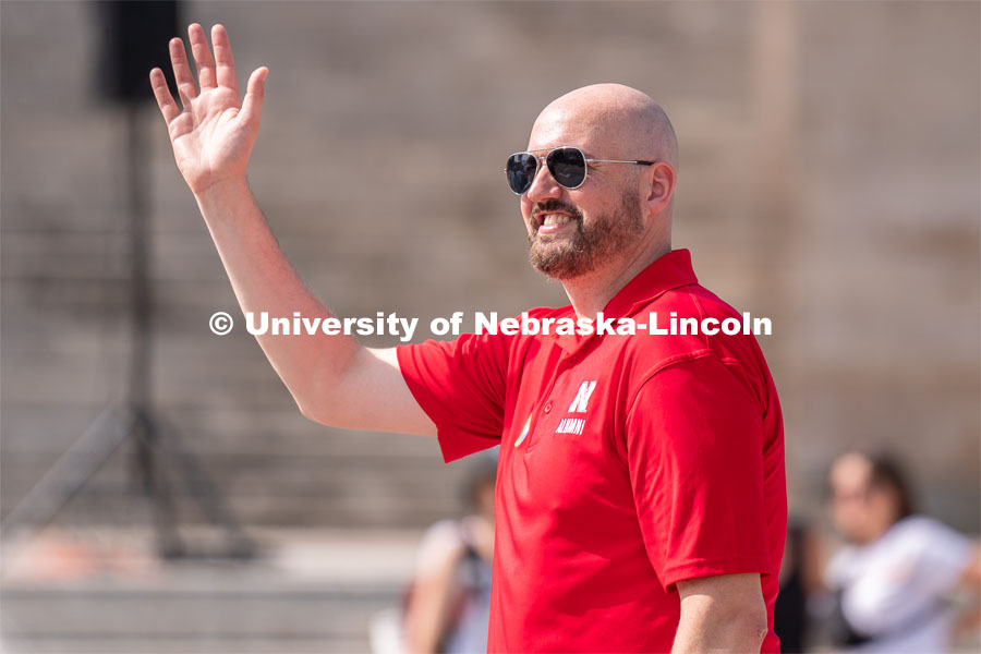 University of Nebraska representatives wave to the crowd during the Star City Pride parade. June 18, 2022. Photo by Jordan Opp for University Communication.