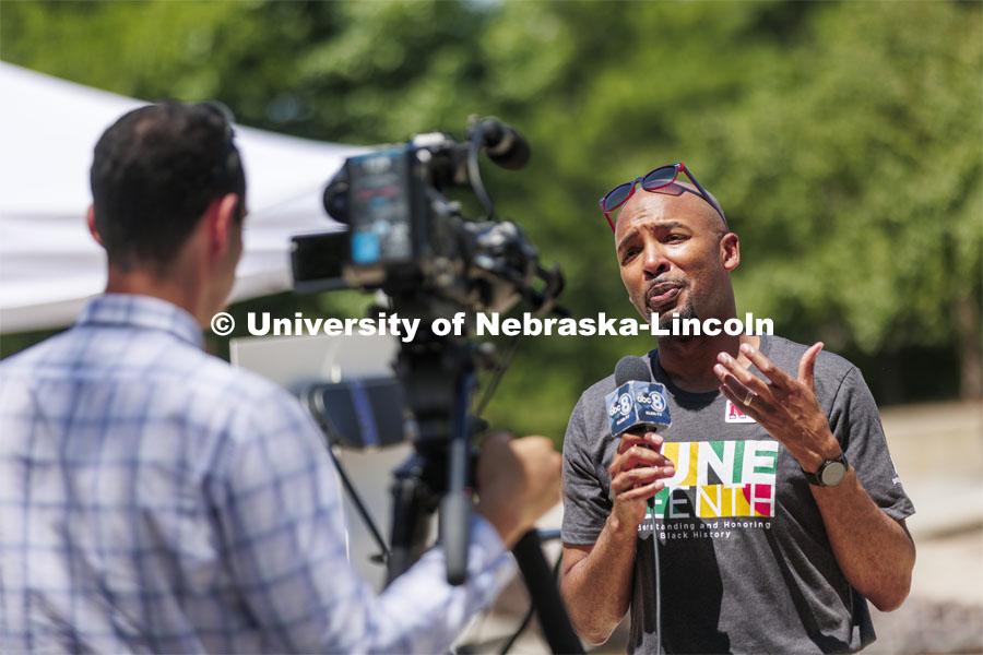 Marco Barker, Vice Chancellor for Diversity and Inclusion, speaks with local news affiliate KLKN-TV from the plaza of the Nebraska Union. Juneteenth, the federal holiday that commemorates the emancipation of enslaved Black Americans, is celebrated in an event starting at noon on the Nebraska Union Plaza. June 20, 2022. Photo by Craig Chandler / University Communication.
