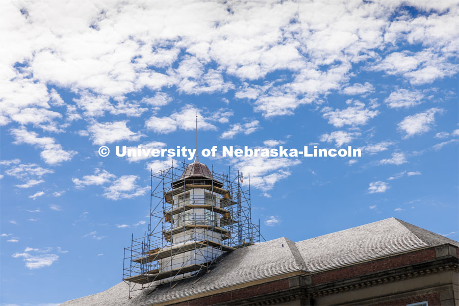 Scaffolding work begins to surround the Love Library cupola as part of the renovation process. Love Library cupola renovation. June 22, 2022. Photo by Craig Chandler / University Communication.