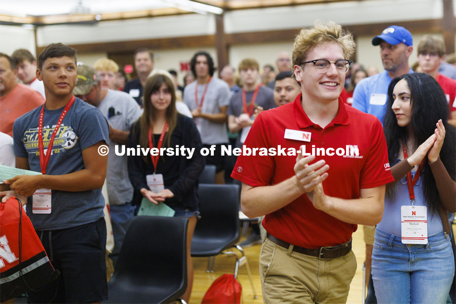New Student Enrollment leader Paul Pechous runs into the Union ballroom to start the day. June 22, 2022. Photo by Craig Chandler / University Communication.