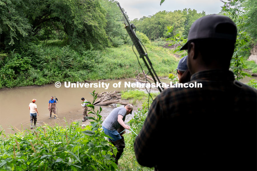 Students take turns climbing down to Salt Creek using a rope at Wilderness Park. Irrigation Laboratory and Field Course class trip to Salt Creek at Wilderness Park. July 8, 2022. Photo by Jordan Opp for University Communication.