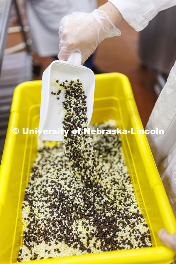 Chocolate and white chocolate chips are mixed for 4-H Clover Mint is being made at Food Innovation Center on Nebraska Innovation Campus. July 18, 2022. Photo by Craig Chandler / University Communication.