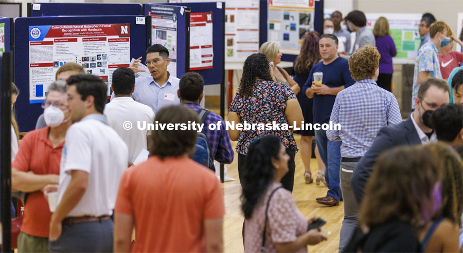 Ricardo Canovas of California State University discusses his summer research with facial recognition. Poster fair for Nebraska Summer Research Program in Nebraska Union ballroom. August 5, 2022. Photo by Craig Chandler / University Communication.