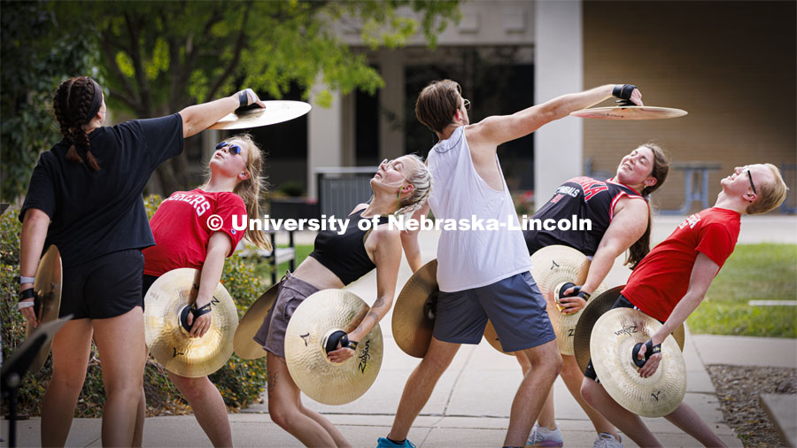 The Cornhusker Marching Band percussion groups kick off the school year at Cornhusker Marching Band camp. Cymbals doing their performance art with a shout out to the Matrix. They call this “Blade Time”. August 11, 2022. Photo by Craig Chandler / University Communication.