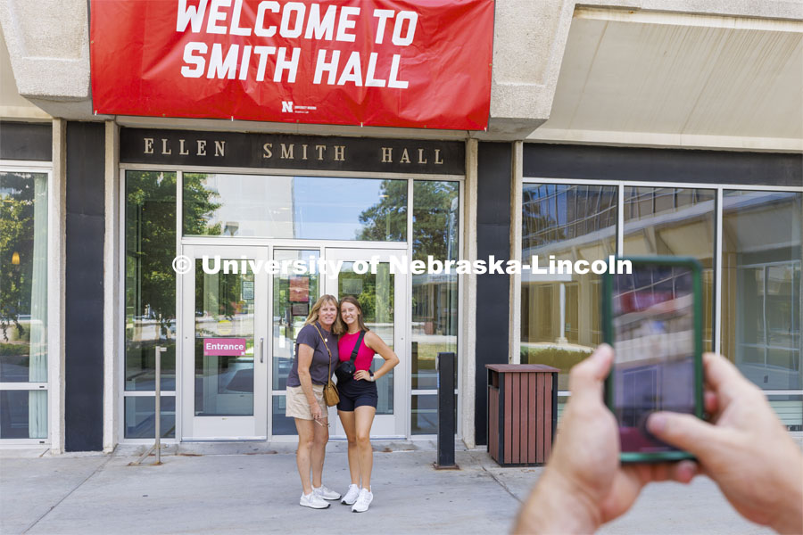 Rachael Volin of Lincoln poses with her mom, Beth, in front of Smith Hall. Not only did her mom attend UNL but also through a twist of fate lived next door to her daughter’s new room. Residence Hall move in for students participating in Greek Rush. August 14, 2022. Photo by Craig Chandler / University Communication.
