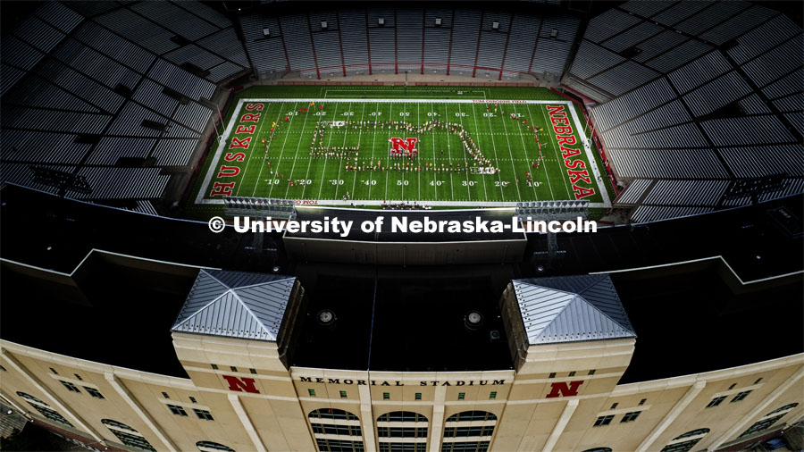 The band forms an outline of the state of Nebraska. Cornhusker Marching Band practice in Memorial Stadium under the lights. August 18, 2022. Photo by Craig Chandler / University Communication.