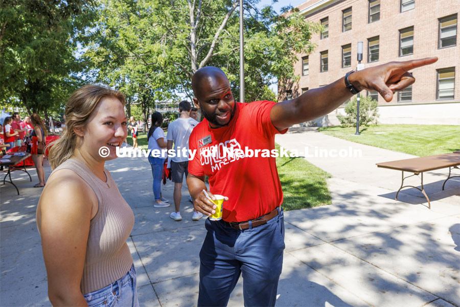 Nicolas Gordan, a College of Arts and Sciences recruiter helps a student at the CAS College Welcome for new and returning students. Big Red Welcome - College Welcome Programs. August 18, 2022. Photo by Craig Chandler / University Communication.