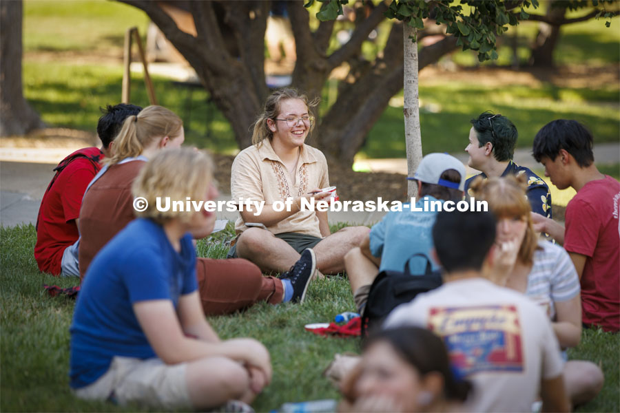 Sam Pharris, a freshman from Aberdeen, South Dakota, talks with new friends at the Hixon-Lied College of Fine and Performing Arts for their College Welcome for new and returning students. Big Red Welcome - College Welcome Programs. August 18, 2022. Photo by Craig Chandler / University Communication.