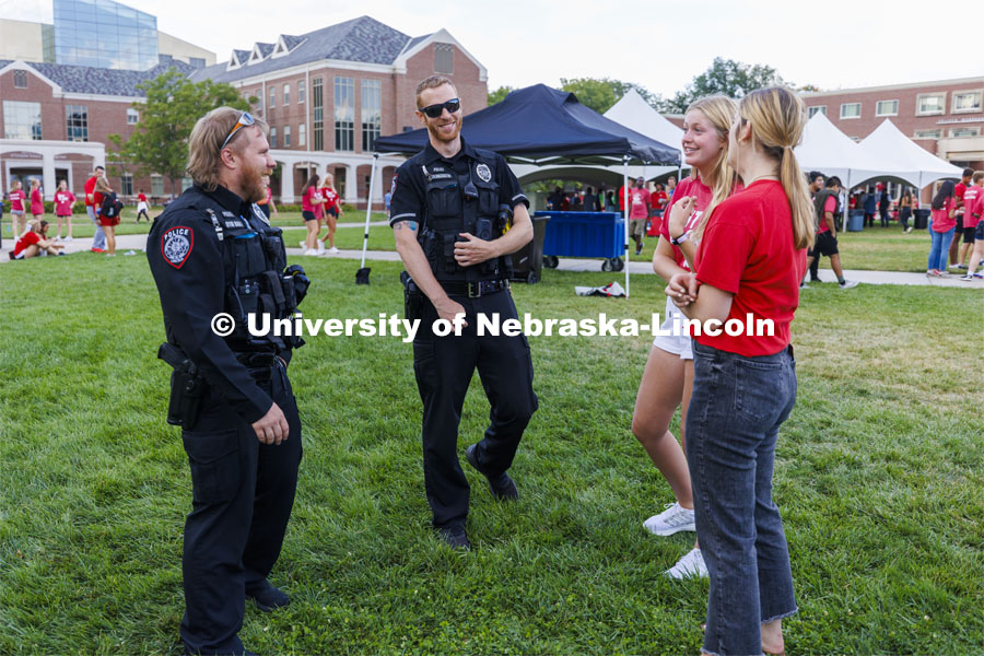 UNL Police Department officers talk with students at the Chancellor’s BBQ to welcome the class of 2026 in the greenspace by the Nebraska Union. August 19, 2022. Photo by Craig Chandler / University Communication.