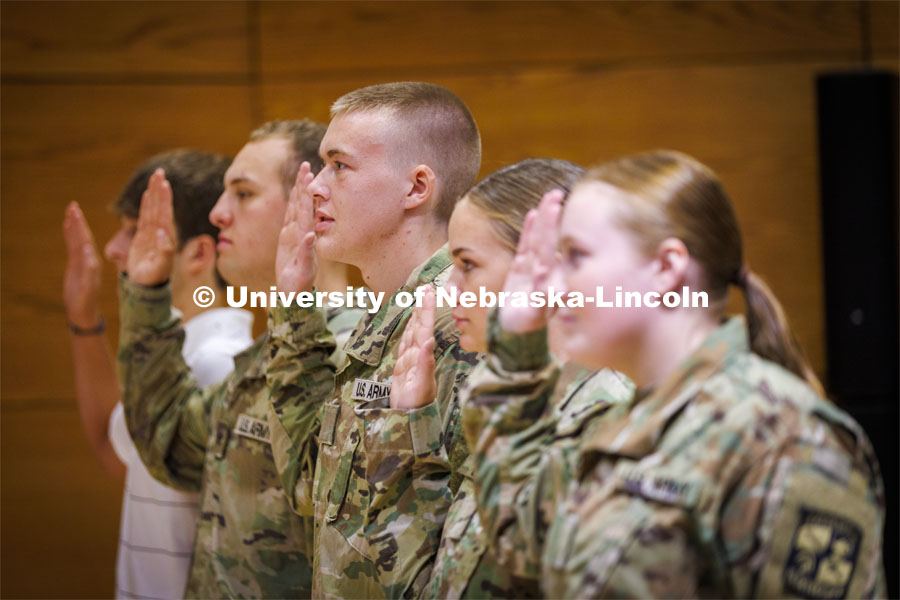 ROTC cadet Kolby Daily recites the oath given by Lt. Col. Mark Peer at the contracting ceremony. The ceremony concludes the contracting event, so they are now receiving their full scholarship benefits. August 19, 2022. Photo by Craig Chandler / University Communication.