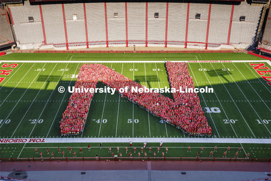 Freshman students form the N on the Memorial Stadium field for the class of 2026 photo. Tunnel Walk and New Student Welcome in Memorial Stadium. August 19, 2022. Photo by Jordan Opp for University Communication.