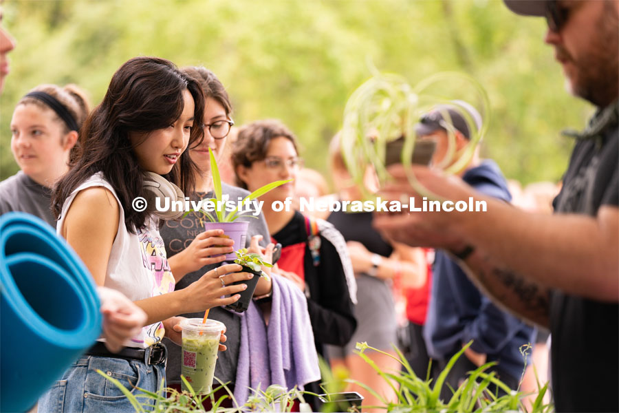 Students potting plants for their rooms at the Wellness Fest and Goat Yoga on the Nebraska Union green space. August 20, 2022. Photo by Jordan Opp for University Communication