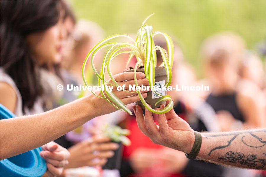 Students potting plants for their rooms at the Wellness Fest and Goat Yoga on the Nebraska Union green space. August 20, 2022. Photo by Jordan Opp for University Communication