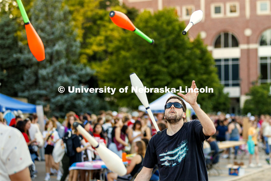 Steven Strausberg with the Lincoln City Juggling Club puts on a demonstration Sunday. Sunday, the Street Fest filled the parking lot by East Stadium with hundreds of booths hosted by local businesses, nonprofit organizations, UNL departments and plenty of music, free food, giveaways and prizes. August 21, 2022. Photo by Craig Chandler / University Communication.