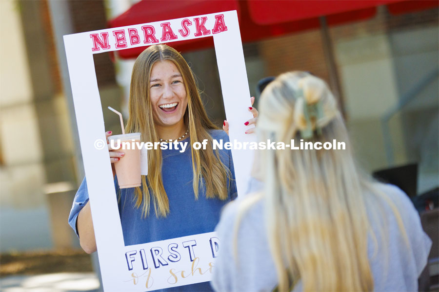 Jada Scribner, a sophomore from Woodbury, Minnesota, has a great smile, a smoothie and a first day of school photo. Husker Catholic took photos in front of the Nebraska Union of anyone who wanted a first day of school photo. First day of classes. August 22, 2022. Photo by Craig Chandler / University Communication.