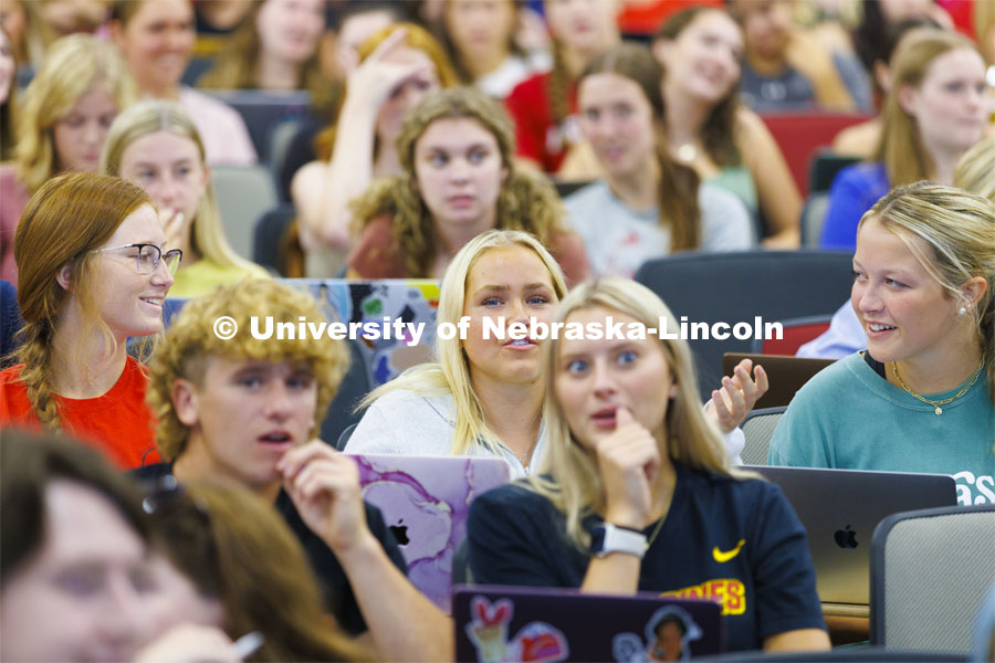 Students in Brian Couch’s LIFE120 class discuss possible answers to four lighthearted questions Professor Couch posed to the class. First day of classes. August 22, 2022. Photo by Craig Chandler / University Communication.