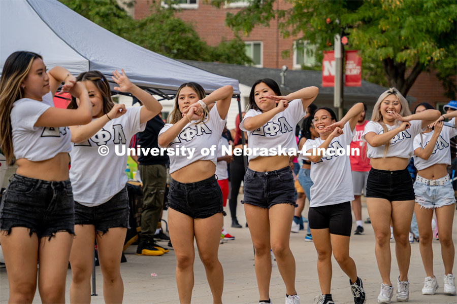 Members of Delta Phi Lambda Sorority Inc. outside the Union strolling during The Block Party. August 26, 2022. Photo by Jonah Tran/ University Communication.