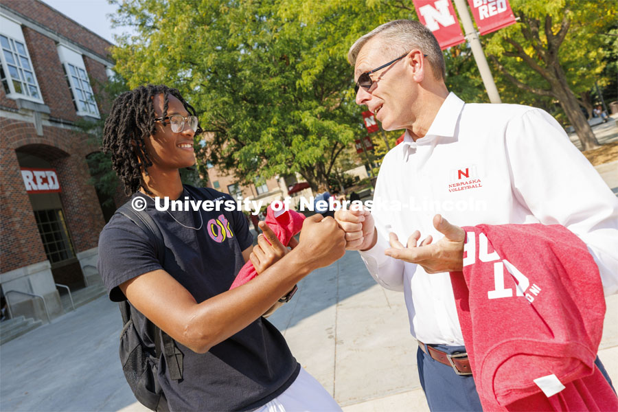 Chancellor Ronnie Green hands out Grit and Glory t-shirts at the Nebraska Union Plaza. September 7, 2022.  Photo by Craig Chandler / University Communication.