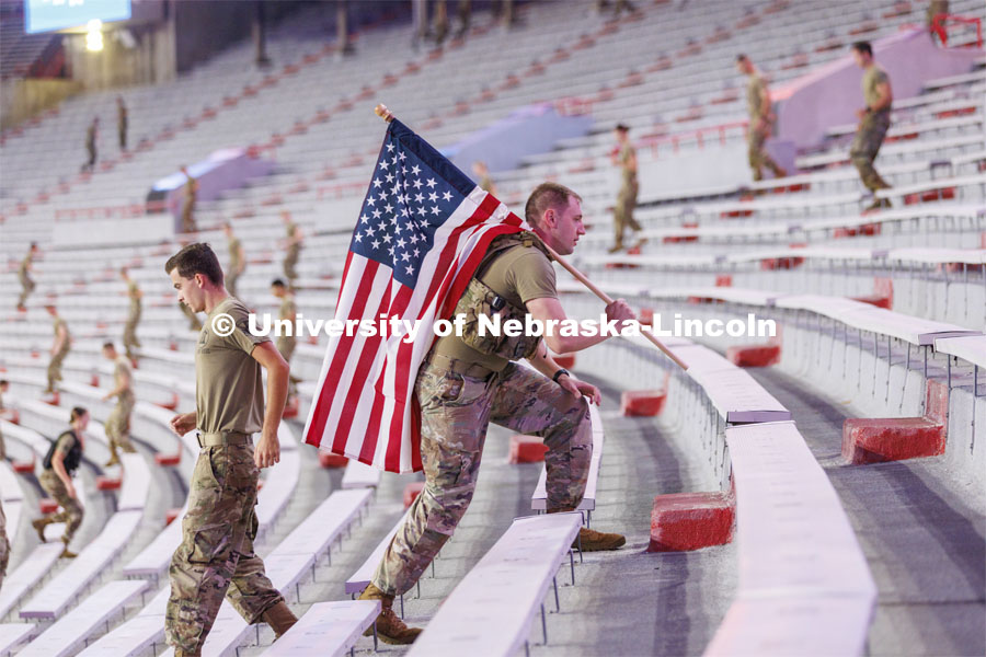 US Army Staff Sergeant Kyle Aldrich, a local recruiter, ran the steps carrying an American flag. More than 160 UNL ROTC cadets along with active-duty military personnel, local first responders and UNO Air Force ROTC cadets ran 2200 steps in Memorial Stadium today. The run honors the first responders who ran up the 110 floors of the World Trade Center on 9/11. September 8, 2022. Photo by Craig Chandler / University Communication.