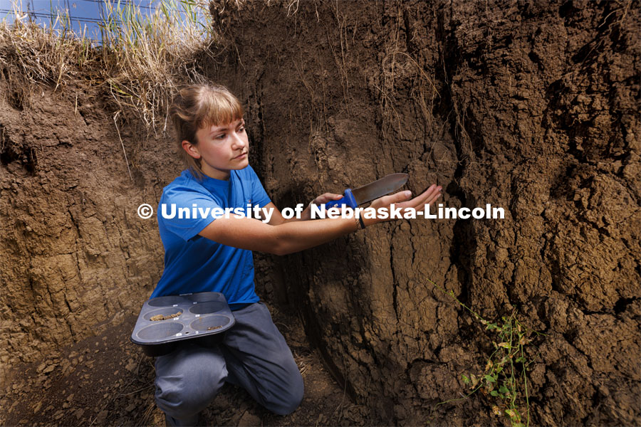 Kennadi Griffis takes a soil sample from one of the layers–called horizons in soil judging terms–in the soil judging pit on East Campus. Griffis’ curiosity about the natural environment and the opportunities she found at the University of Nebraska–Lincoln propelled the Husker to an international championship in soil judging as a member of Team USA. September 9, 2022. Photo by Craig Chandler / University Communication.