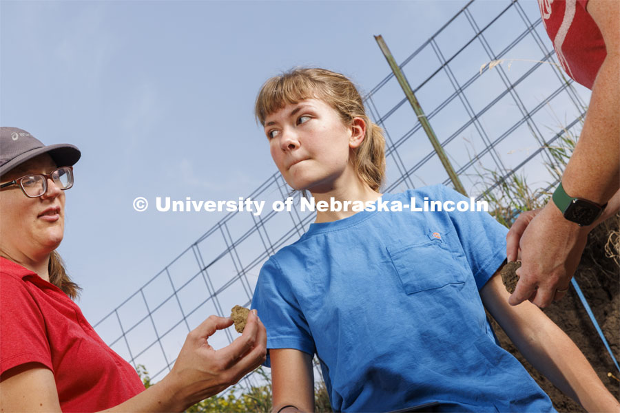 Kennadi Griffis listens to Judith Turk, one of her coaches, as they discuss a soil sample in the pit on East Campus. Griffis’ curiosity about the natural environment and the opportunities she found at the University of Nebraska–Lincoln propelled the Husker to an international championship in soil judging as a member of Team USA. September 9, 2022. Photo by Craig Chandler / University Communication.