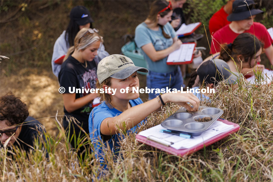 Kennadi Griffis places a sample into a tray for evaluation as she and fellow students in her NRES 279 - Soil Evaluation course work in the east campus soil pit. Griffis’ curiosity about the natural environment and the opportunities she found at the University of Nebraska–Lincoln propelled the Husker to an international championship in soil judging as a member of Team USA. September 9, 2022. Photo by Craig Chandler / University Communication.