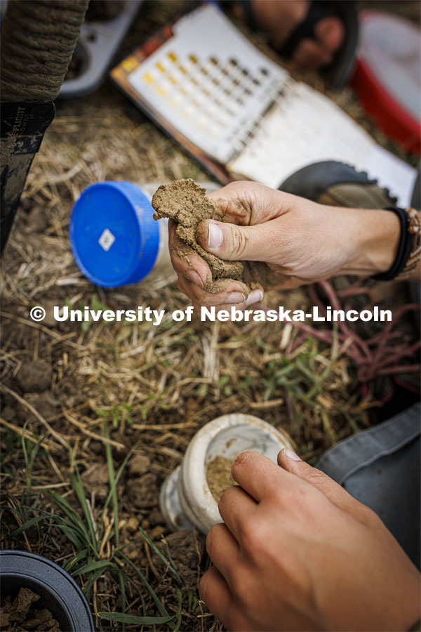 Kennadi Griffis critiques a ribbon of soil—where water is added to a ball of soil and then pressed between two fingers to form a ribbon—as part of her class assignment. Ribboning helps determine the composition of the soil. Griffis’ curiosity about the natural environment and the opportunities she found at the University of Nebraska–Lincoln propelled the Husker to an international championship in soil judging as a member of Team USA. September 9, 2022. Photo by Craig Chandler / University Communication.
