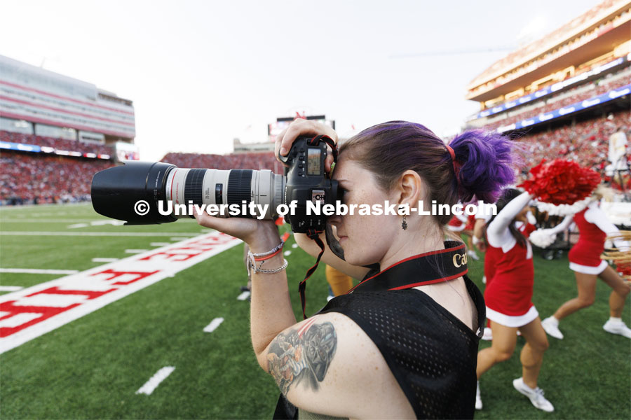 Madison Vinci, a sports media major in the College of Journalism and Mass Communication, photographs the game. Nebraska vs. Georgia Southern football in Memorial Stadium. September 10, 2022. Photo by Craig Chandler / University Communication.