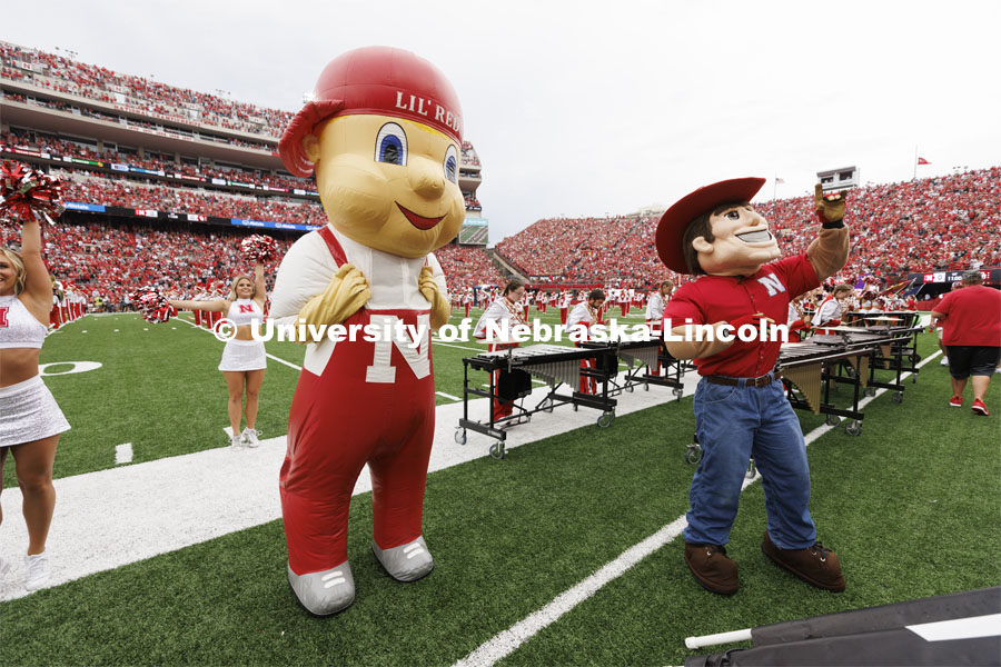 Lil' Red and Herbie Husker on the field at the Nebraska vs Oklahoma University football in Memorial Stadium. September 17, 2022. Photo by Craig Chandler / University Communication.