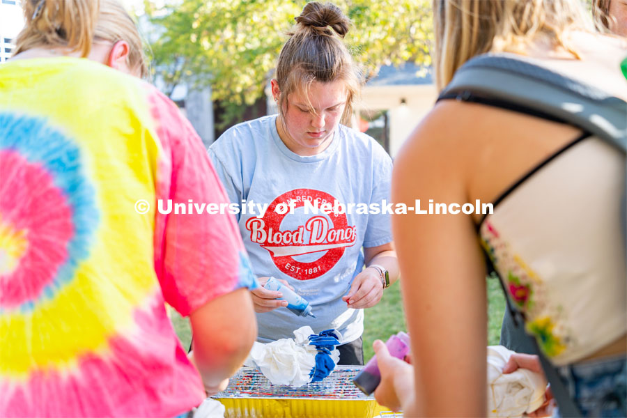 Students tie-dye “Peace, Love, Consent” t-shirt (while supplies last) and visit booths to learn more about CONSENT and how to ask for it. The event was sponsored by Center for Advocacy, Response and Education (CARE) and Big Red Resilience and Well-being. September 20, 2022. Photo by Jonah Tran/ University Communication.